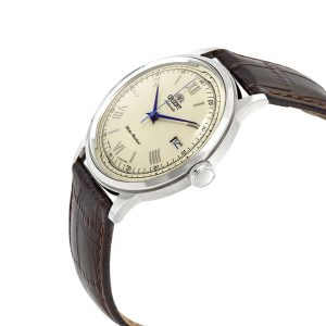 ساعت مچی مردانه اورینت بامبینو مدل AC00009W (FAC00009W0) رنگ کرمی با عقربه‌های آبی، بند چرمی قهوه‌ای و صفحه گنبدی کلاسیک؛ ساعت اتوماتیک اصل ژاپنی مناسب استایل رسمی و روزمره